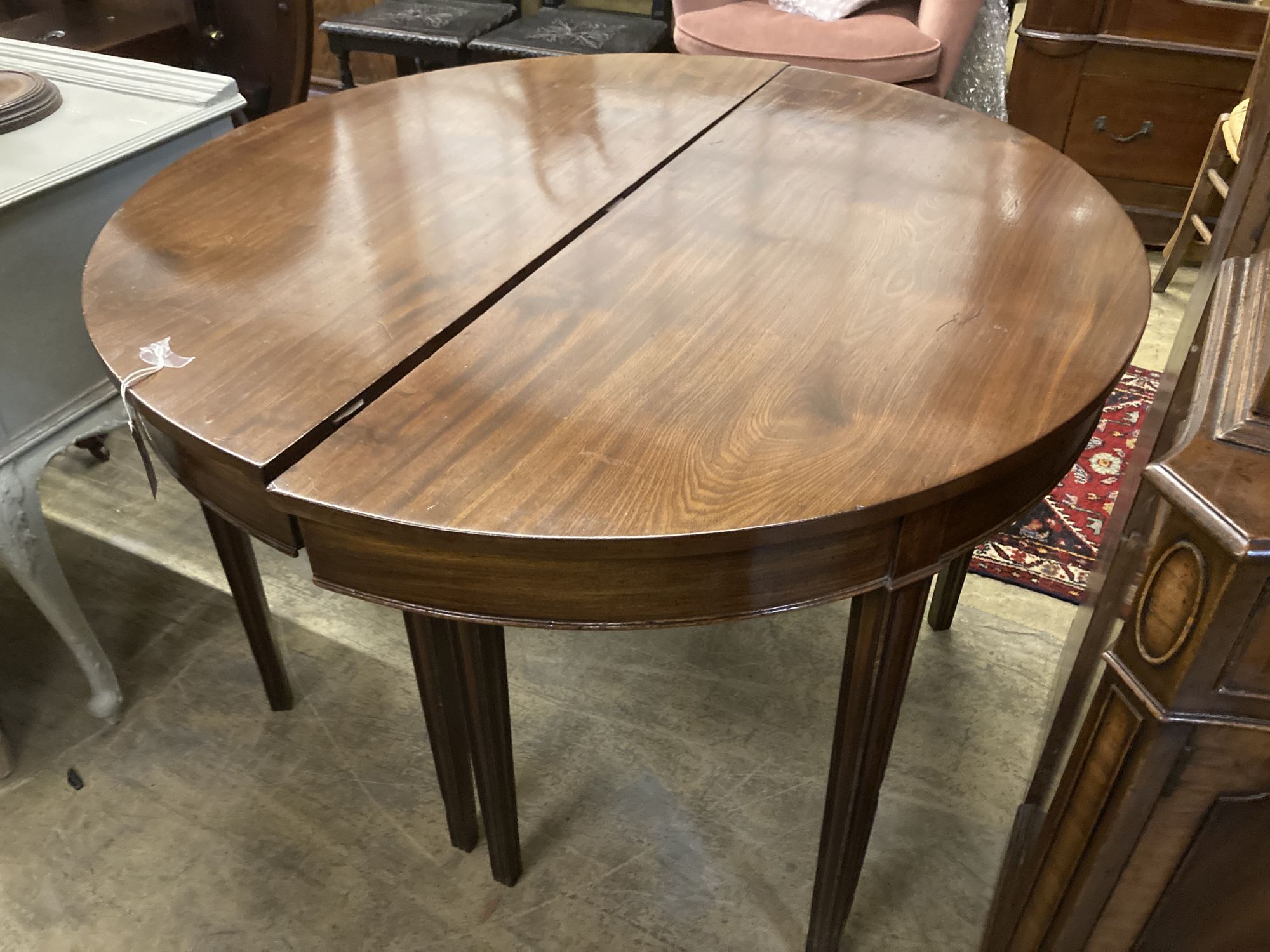 A George III mahogany D end extending dining table, 220cm extended (two spare leaves) width 111cm height 77cm